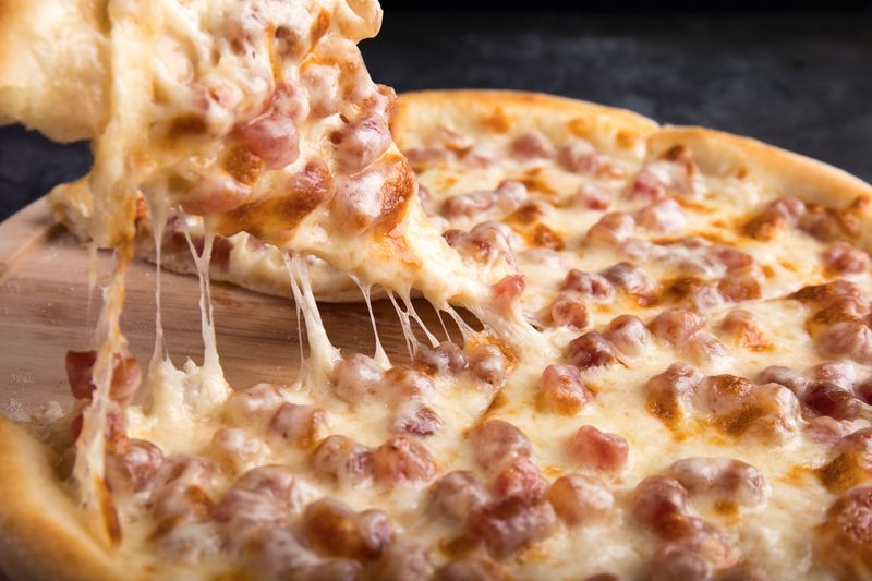 Four cheese pizza with golden melted cheese blend